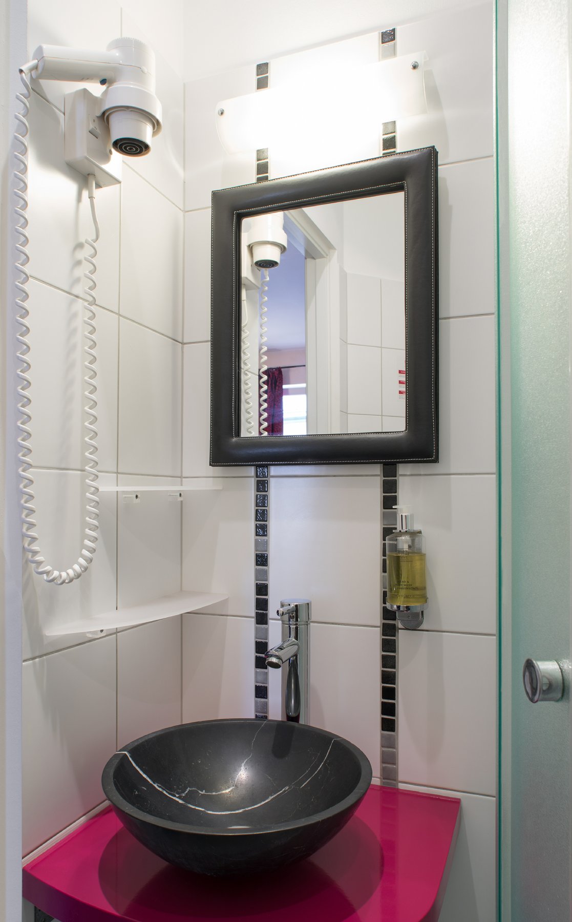 Bathroom with black marble sink